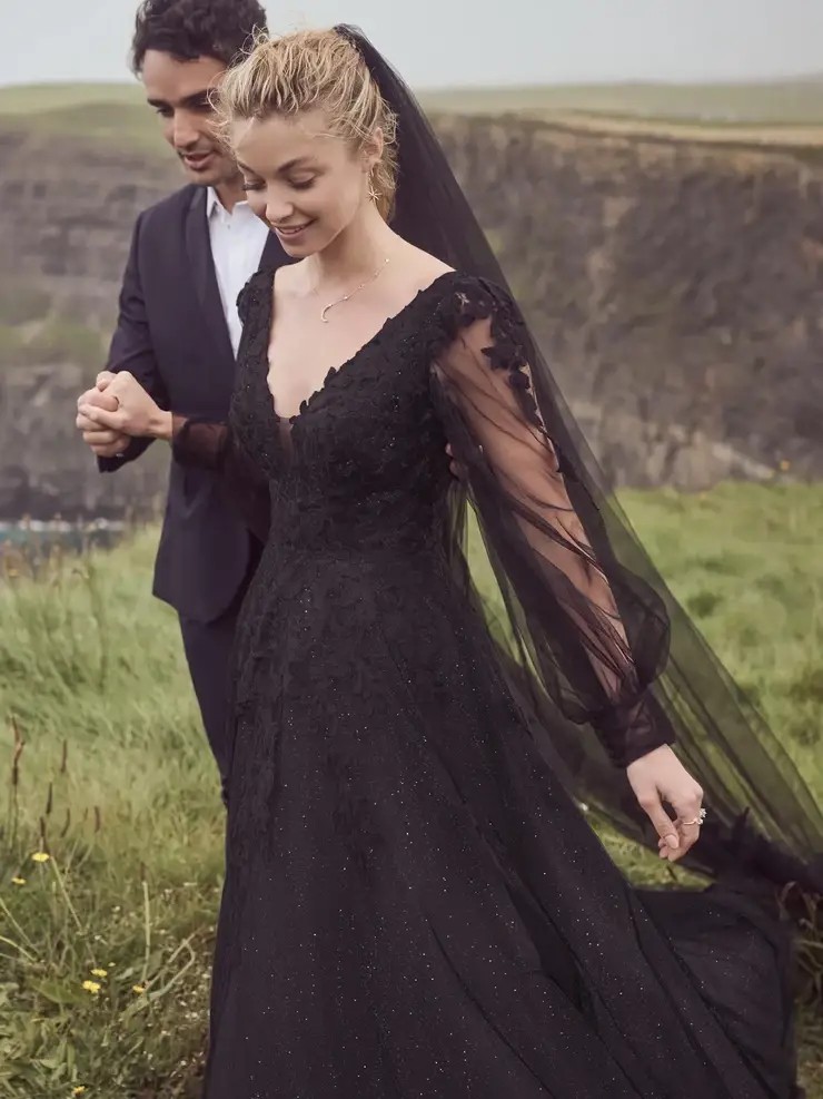 Model wearing a bridal Rebecca Ingram gown