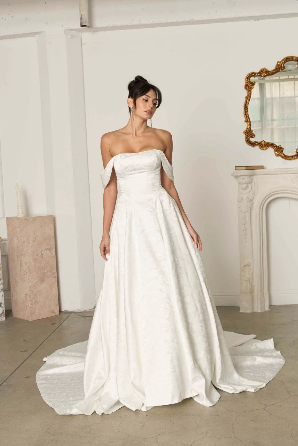 Model wearing a bridal gown by Serene