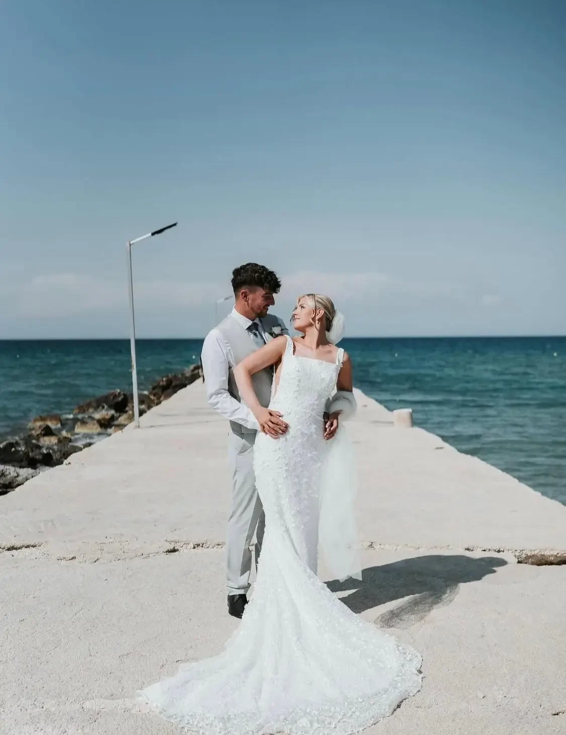 Bride in ivory gown with groom