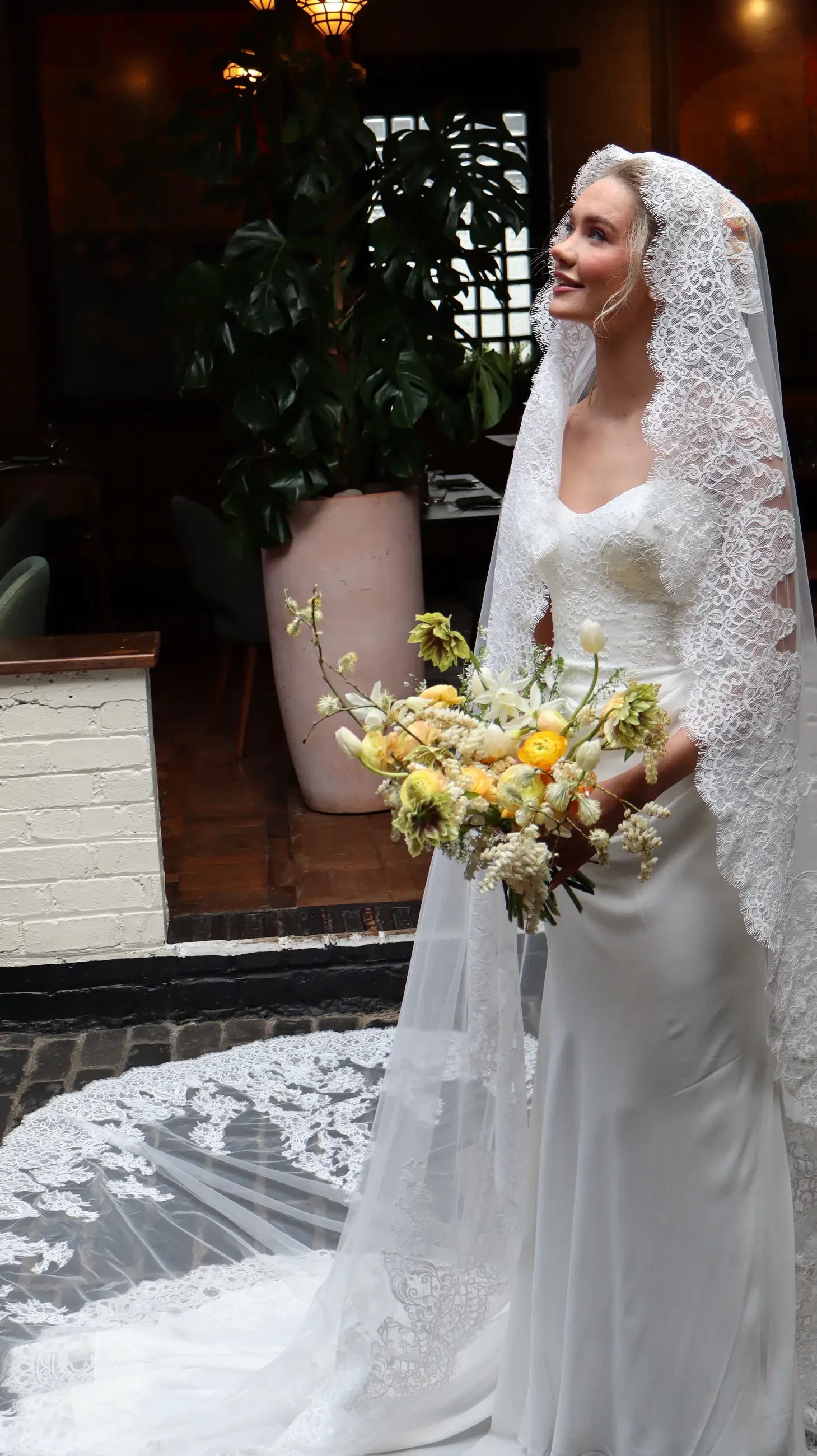 model wearing a bridal gown with veil